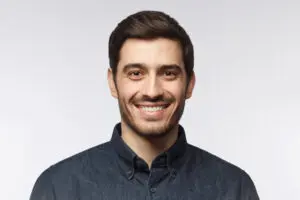 man with nice smile dental crown concept