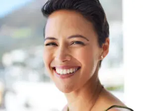 Outdoor, dental or portrait of happy woman with confidence, teeth whitening or oral care for healthy veneers. Dentist, smile or face of orthodontist laughing with beauty, tooth implant or clean mouth.